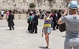 Tourists in front of the Western Wall in Jerusalem's Old City in May 2012. (photo credit: Uri Lenz/Flash 90)