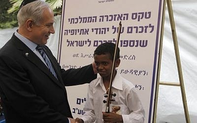 Prime Minister Benjamin Netanyahu participates in a ceremony at Mount Herzl, for the Ethiopian Jews who died while making their way to Israel, at Mount Herzl in May 2012. (photo credit: Uri Lenz/Flash90) Prime Minister Benjamin Netanyahu participates in a ceremony at Mount Herzl, for the Ethiopian Jews who died while making their way to Israel, at Mount Herzl in May 2012. (photo credit: Uri Lenz/Flash90)