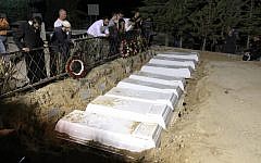 Eight members of the Attias family, killed in a car crash, buried side by side (photo credit: Hamad Almakt/Flash90)