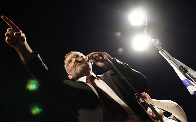 MK Michael Ben-Ari (National Union) speaking to protesters in South Tel Aviv on Wednesday (photo credit: Tomer Neuberg/Flash90)