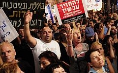 South Tel Aviv residents protest the influx of migrants in their neighborhoods in May 2012. (photo credit: Tomer Neuberg/Flash90)
