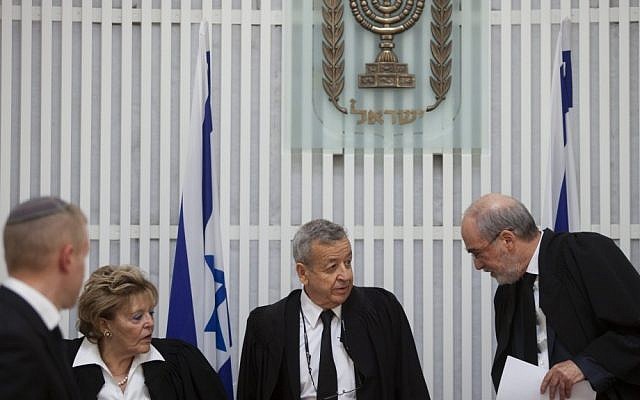 Vice Supreme Court President Eliezer Rivlin (center) flanked by Supreme Court President Asher Grunis (right) and Judge Edna Arbel (left) at a ceremony in honor of Rivlin's retirement from the Supreme Court (photo credit: David Vaaknin/Flash90)