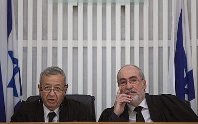Supreme Court President Asher Grunis (right) sitting next to outgoing Vice Supreme Court President Eliezer Rivlin at a ceremony in honor of Rivlin's retirement from the court Thursday (photo credit: David Vaaknin/Flash90)
