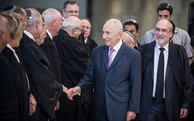 President Shimon Peres greets judges at a swearing-in ceremony of the new Supreme Court justices at the Supreme Court on Thursday (photo credit: Noam Moskowitz/Flash90) President Shimon Peres greets judges at a swearing-in ceremony of the new Supreme Court justices at the Supreme Court on Thursday (photo credit: Noam Moskowitz/Flash90)
