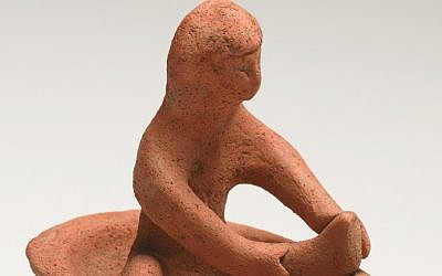 The figurine of the bathing woman was buried in a Phoenician grave in the 8th or 7th century B.C.E. (Photo credit: Courtesy of the Israel Museum)