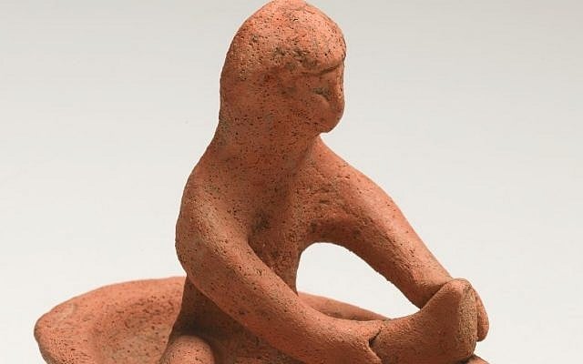 The figurine of the bathing woman was buried in a Phoenician grave in the 8th or 7th century B.C.E. (Photo credit: Courtesy of the Israel Museum)