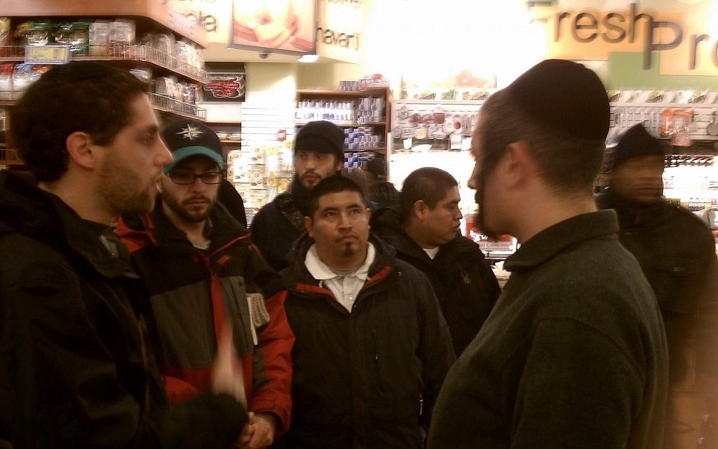 Ari Hart, left, and other Uri L'Tzedek activists protest Flaum's Appetizing with former Flaum employees at Associated Supermarket on the Upper West Side of Manhattan, January 2012. (photo credit: Courtesy Uri L'Tzedek/JTA) Ari Hart, left, and other Uri L'Tzedek activists protest Flaum's Appetizing with former Flaum employees at Associated Supermarket on the Upper West Side of Manhattan, January 2012. (photo credit: Courtesy Uri L'Tzedek/JTA)