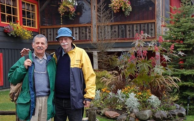 This September 2010 picture provided by the family shows Tim Smulian, a South African citizen, left, and Edwin Blesch, an American, outside the Au Petit Poucet restaurant in Val David, Quebec, Canada. They married in 2007 in South Africa. (photo credit: AP)