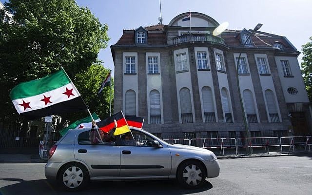 Anti-Assad protesters drive by the Syrian embassy in Berlin, Germany (photo credit: AP Photo/dapd/Clemens Bilan) Anti-Assad protesters drive by the Syrian embassy in Berlin, Germany (photo credit: AP Photo/dapd/Clemens Bilan)