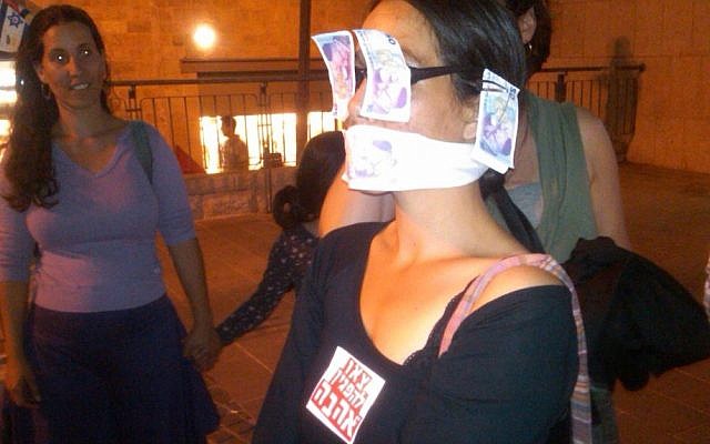 An Israeli woman protests the government's economic policy in Jerusalem Saturday. (photo credit: Ilan Ben Zion)