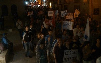 'To whom does this country belong?' asked demonstrators in Jerusalem Saturday. (photo credit: Ilan Ben Zion)