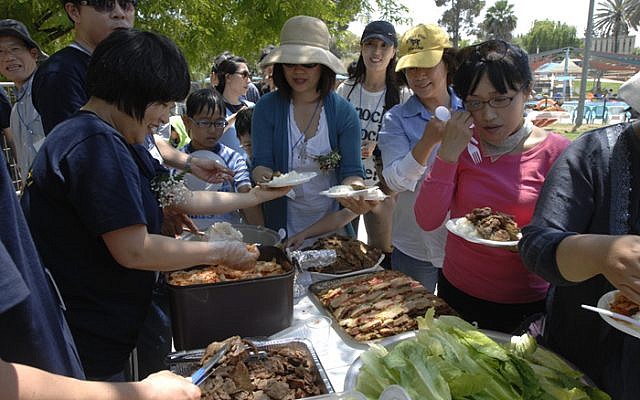 Members of the Korean community in Israel gather in Kfar Menachem (photo credit: JTA/Kangkeun Lee)