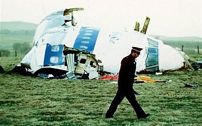A police officer walks by the nose of Pan Am flight 103 in a field near the town of Lockerbie, Scotland, 1988 (AP/Martin Cleaver)