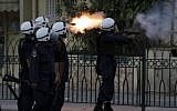 Illustrative: Riot police fire at anti-government protesters in Bahrain (photo credit: AP Photo/Hasan Jamali)