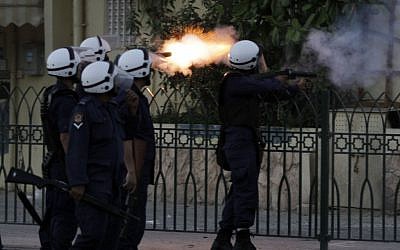 Illustrative: Riot police fire at anti-government protesters in Bahrain (photo credit: AP Photo/Hasan Jamali)