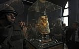 Egyptian special forces stand next to the funeral mask of King Tutankhamun in its glass case in the Egyptian Museum in Cairo (photo credit: AP/Tara Todras-Whitehill, File)