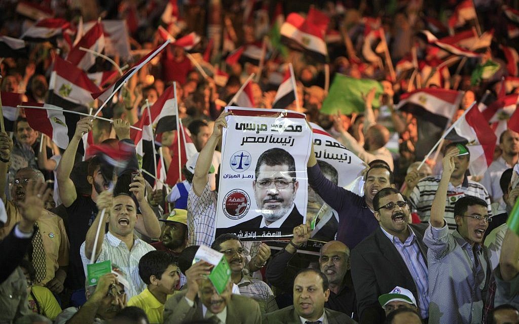 Egyptian supporters of Mohammed Morsi, Muslim Brotherhood's presidential candidate (photo credit: Amr Nabil/AP) Egyptian supporters of Mohammed Morsi, Muslim Brotherhood's presidential candidate (photo credit: Amr Nabil/AP)
