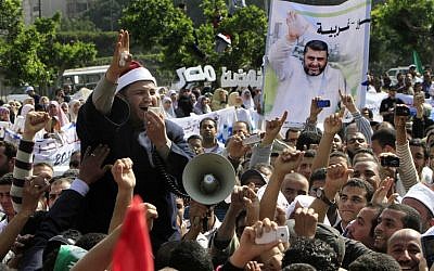 Muslim Brotherhood supporters demonstrate in Cairo (photo credit: AP Photo/Amr Nabil)