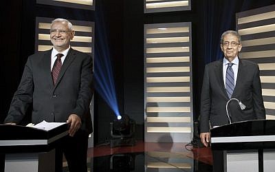 Presidential candidates Amr Moussa and Abd Al-Munim Abu-Fattouh in a televised debate May 11 (photo credit: AP Photo/Mahmoud Khaled)