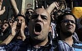 Egyptian protesters chant anti-military slogans in Cairo Sunday (photo credit: AP/Nasser Nasser)