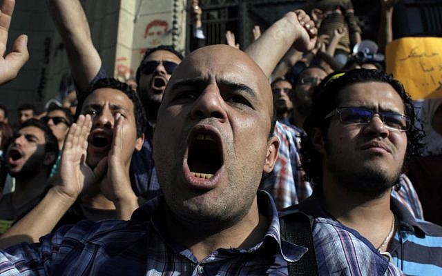 Egyptian protesters chant anti-military slogans in Cairo Sunday (photo credit: AP/Nasser Nasser)