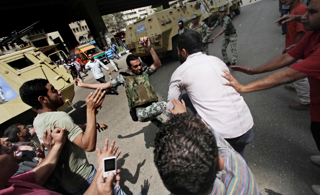 Protesters clash with Egyptian military outside the Defense Ministry in Cairo, May 3. (photo credit:AP Photo) Protesters clash with Egyptian military outside the Defense Ministry in Cairo, May 3. (photo credit:AP Photo)