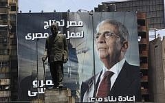 An election poster of presidential candidate Amr Moussa. It reads, "Egypt's reconstruction needs the effort of all Egyptians," in Cairo, Egypt, last week. (photo credit: Nasser Nasser/AP)