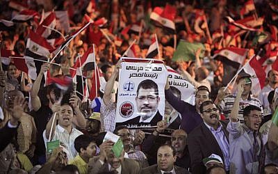 Supporters of Mohammed Morsi, the Muslim Brotherhood's presidential candidate, during an April 30 campaign conference in Cairo (photo credit: AP/Amr Nabil)