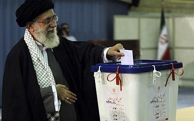 Iranian supreme leader Ayatollah Ali Khamenei,casts his ballot for the parliamentary runoff elections, in Tehran, last May (photo credit: AP/Office of the Iranian Supreme Leader)