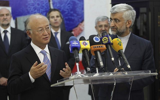 International Atomic Energy Agency (IAEA) chief Yukiya Amano, left, talks with reporters during a news briefing at the conclusion of his meeting with Iran's top nuclear negotiator, Saeed Jalili, right, in Tehran, on Monday (photo credit: AP/IRNA,Adel Pazzyar)