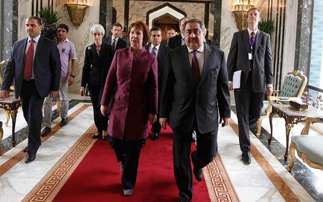 Iraq's Foreign Minister Hoshyar Zebari, 2nd right, walks with the EU foreign policy chief Catherine Ashton upon her arrival at Baghdad International Airport in Iraq, Wednesday. (photo credit: AP/Mohammed Nameen/pool)