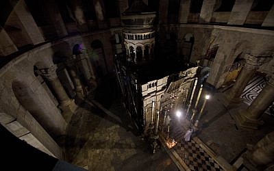 File: Greek Orthodox priests hold liturgy outside the tomb of Jesus in the Holy Sepulcher church in Jerusalem. (photo credit:AP/Dusan Vranic)