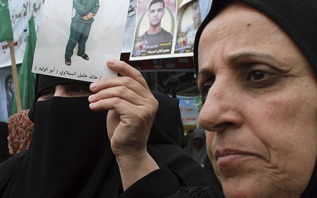 Palestinian women protest in solidarity with hunger strikers (photo credit: AP photo/Hatem Moussa)
