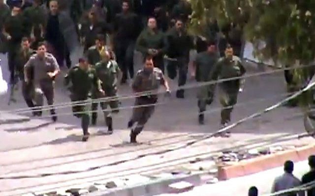 Police running toward a protest in Damascus, Syria, May 2012. The image is taken from an amateur video. AP cannot independently verify the photo. (photo credit: AP/Shaam News Network via AP video) Police running toward a protest in Damascus, Syria, May 2012. The image is taken from an amateur video. AP cannot independently verify the photo. (photo credit: AP/Shaam News Network via AP video)