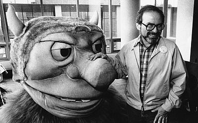 Maurice Sendak posing in 1985 with one of the characters from his book "Where the Wild Things Are,"(photo credit AP)