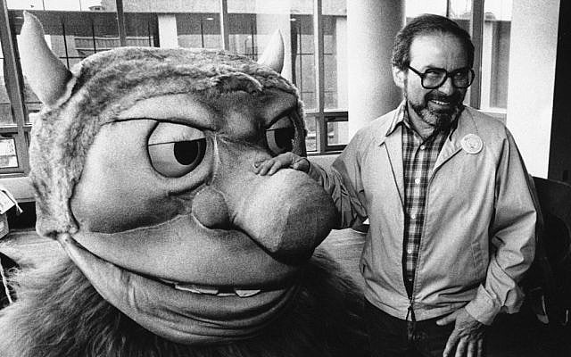 Maurice Sendak posing in 1985 with one of the characters from his book "Where the Wild Things Are,"(photo credit AP)