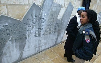 An Ethiopian officer in the IDF at the memorial to Ethiopians who died on their way to Israel, at Mount Herzl in Jerusalem. (photo credit: Olivier Fitoussi /Flash90 /Israeli Pool/File)