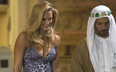 Israeli model Bar Refaeli plays a Mossad seductress with actor Tomer Sisley on a set of a film made about the assassination of Hamas operative Mahmoud al-Mabhouh (AP/Dan Balilty)