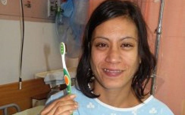 Deep cleaning: Bat-El Panker and the offending toothbrush (photo credit: Carmel Hospital)