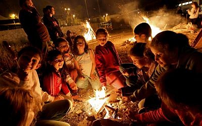 Children gather around the Lag Ba'omer bonfire outside Jerusalem, 2010. (photo credit: Nati Shohat/ Flash90)