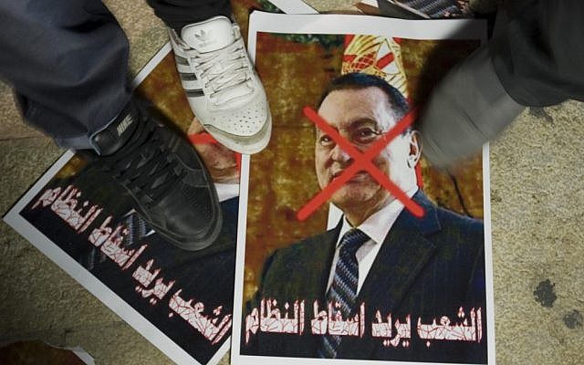 Protesters stomping on a picture of Hosni Mubarak outside the Egyptian Embassy in Tel Aviv in 2011. (photo credit: Flash90)