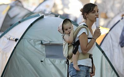 A mother wearing her baby at the 2011 summer protest (photo credit: Nati Shohat/Flash 90)