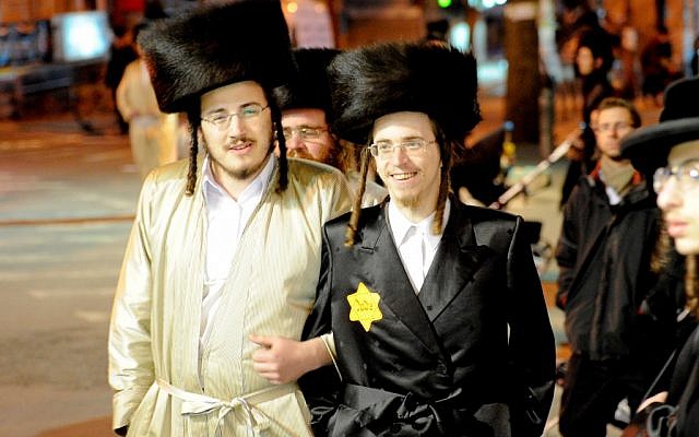 An ultra-Orthodox man wearing a yellow badge at a rally in Jerusalem in December 2011 (photo credit: Flash90) An ultra-Orthodox man wearing a yellow badge at a rally in Jerusalem in December 2011 (photo credit: Flash90)