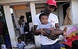 A family of African migrants in the Shapira neighborhood of Tel Aviv (photo credit: Tomer Neuberg/Flash90)