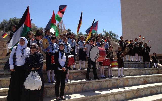 The children of Burin, in the West Bank, cheering for German President Joachim Gauck, who inaugurated a new girls school funded by the German government (photo credit: Raphael Ahren/Times of Israel) The children of Burin, in the West Bank, cheering for German President Joachim Gauck, who inaugurated a new girls school funded by the German government (photo credit: Raphael Ahren/Times of Israel)