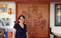 Rabbi Miri Gold in front of the 'Aron Kodesh' at Kibbutz Gezer's Kehilat Birkat Shalom (photo credit: Amanda Borschel-Dan/Times of Israel)