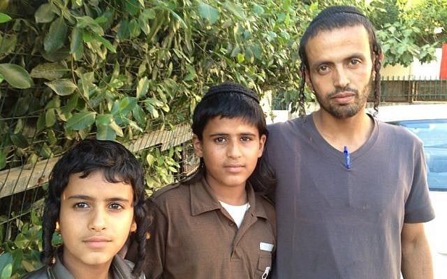 Yahya Zandani (right), poses with two of his brothers in Rehovot following the funeral of their father Aharon, June 27, 2012 (photo credit: Elhanan Miller/Times of Israel)