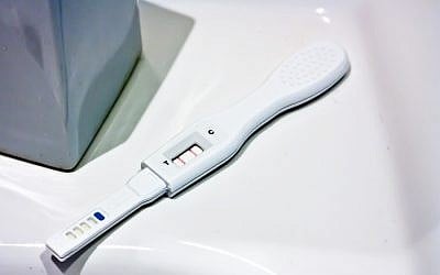 Positive pregnancy test (illustrative photo credit: CC BY-ND Johannes Jander/Flickr)