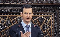 Syrian President Bashar Assad delivers a speech at the parliament in Damascus, Syria, in June (photo credit: SANA/AP)
