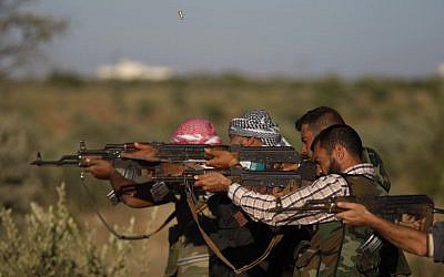 Free Syrian Army members fire at targets as they train on the outskirts of Idlib, Syria, Thursday (photo credit: AP)